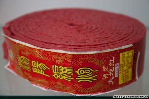 A roll of standard firecrackers, manufactured in China and sold worldwide.